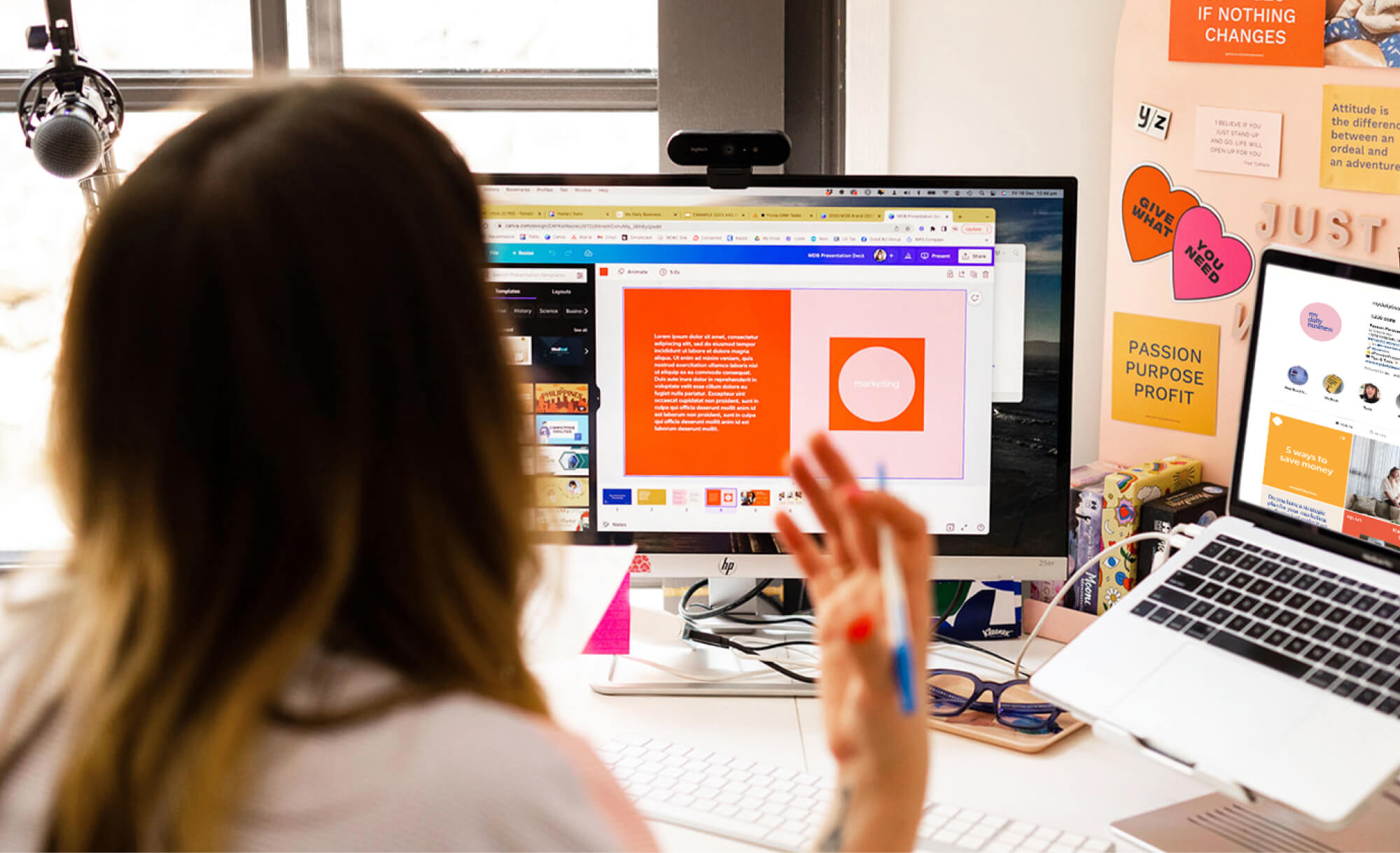 view from behind of lady at computer describing a screen share of a brand identity