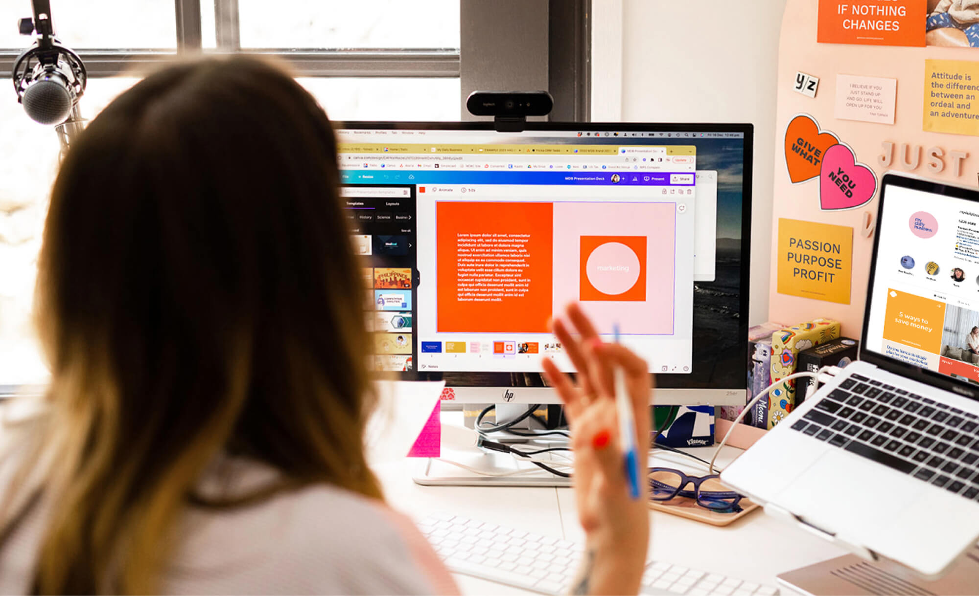 view from behind of lady at computer describing a screen share of a brand identity