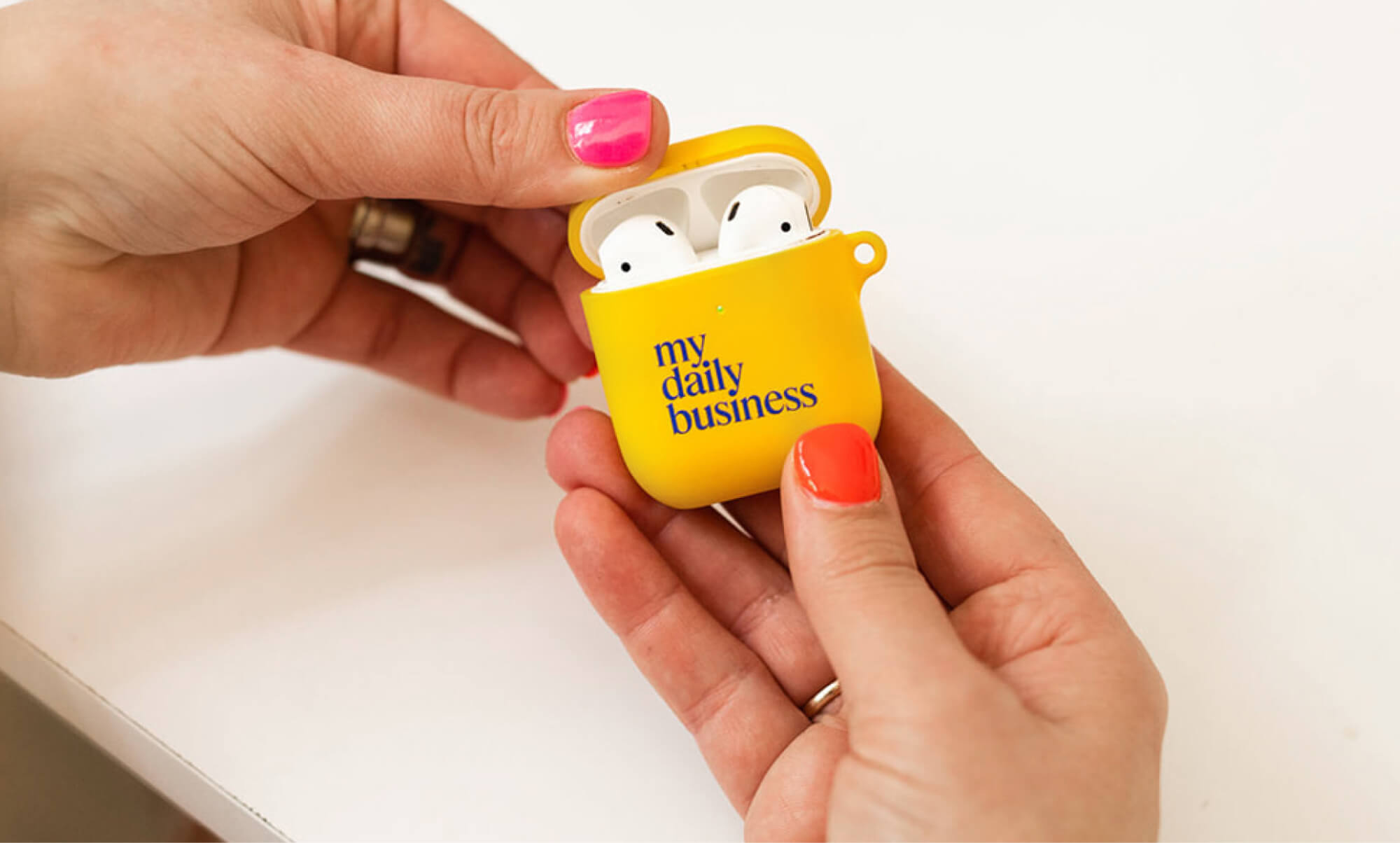 my daily business airpods holder with bright branding