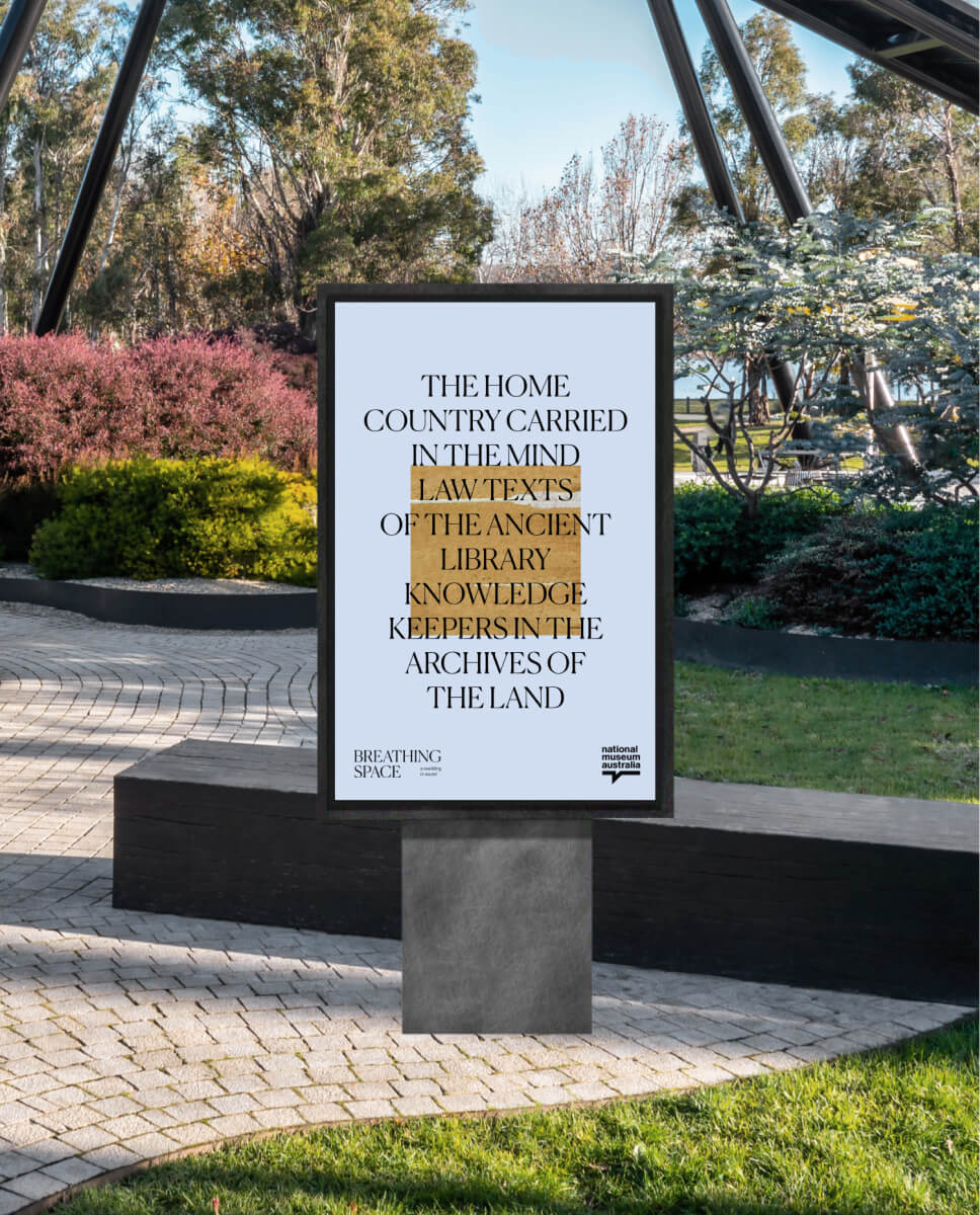 outside signage of the breathing space project in the gardens of the national museum of australia